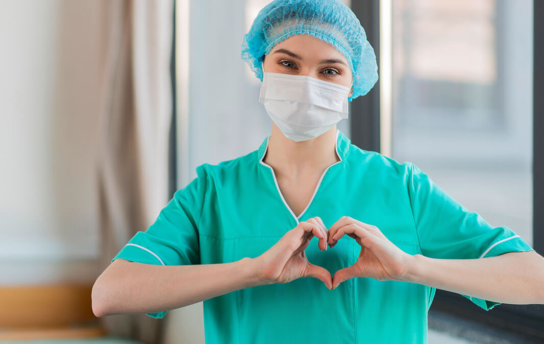 Nurse making heart shape with hands